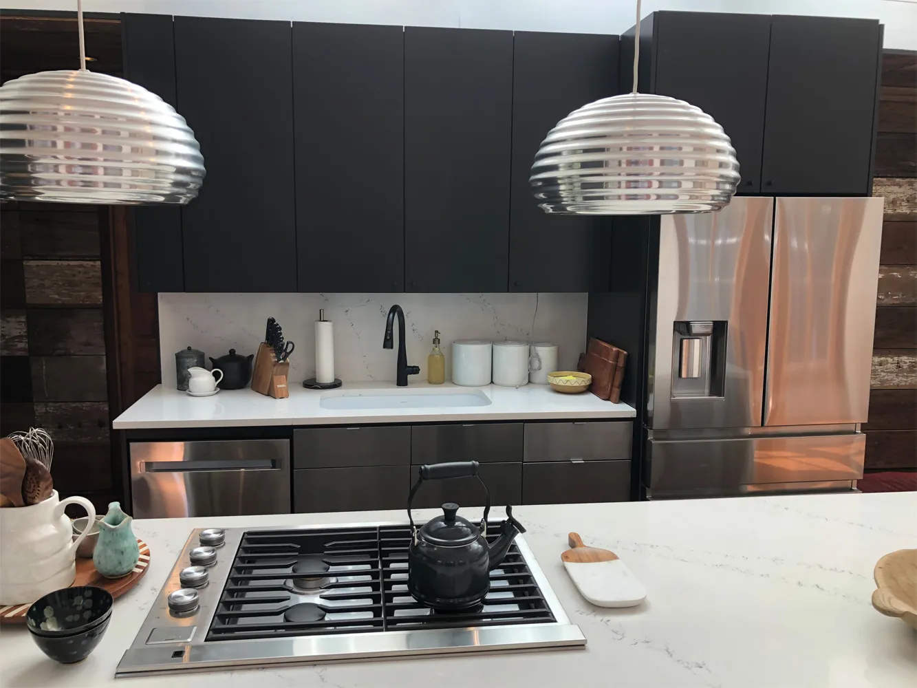 Gas cooktop set into new quartz counters in a Houston kitchen remodel